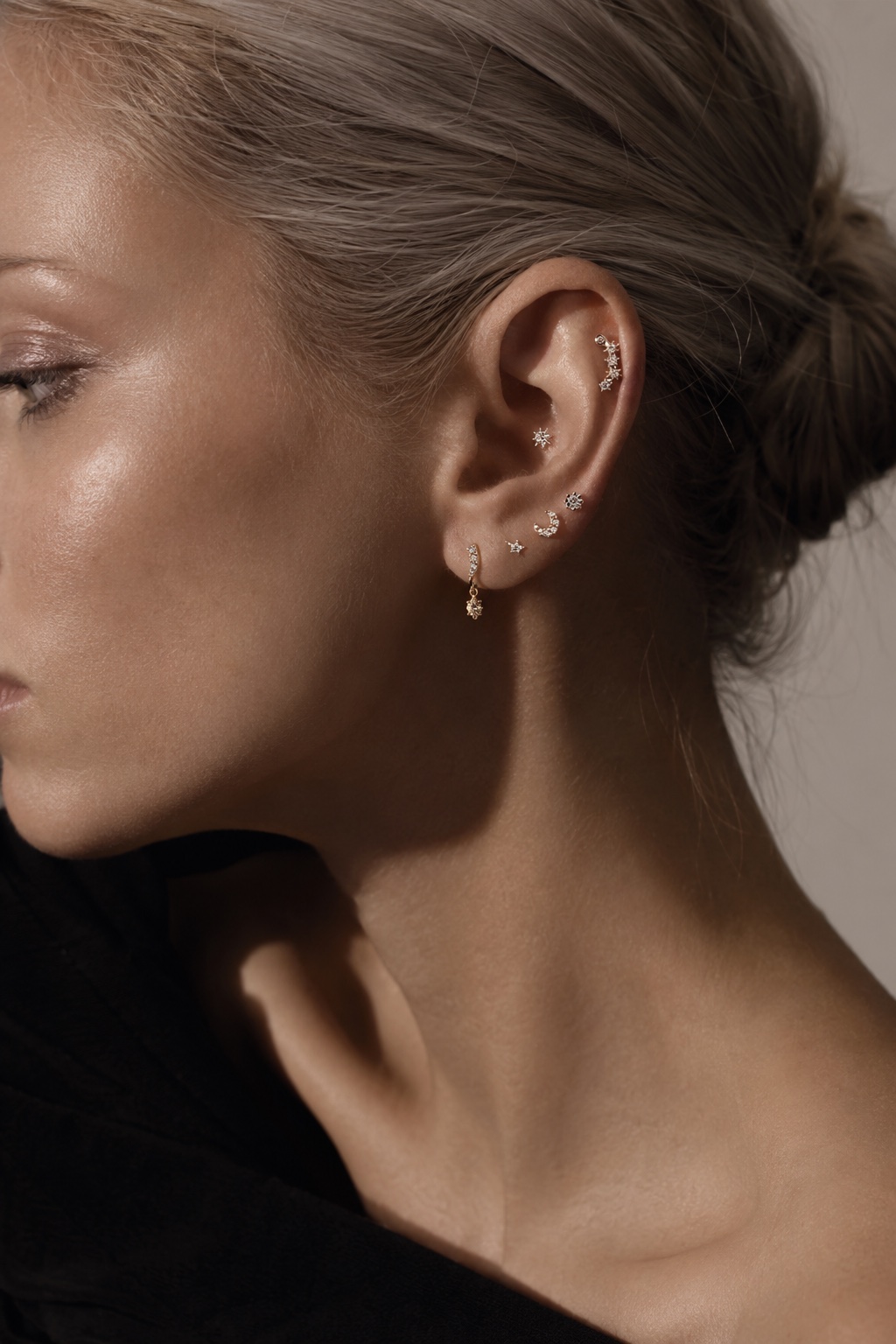 Model wearing a curated Lark & Berry fine jewellery ear stack