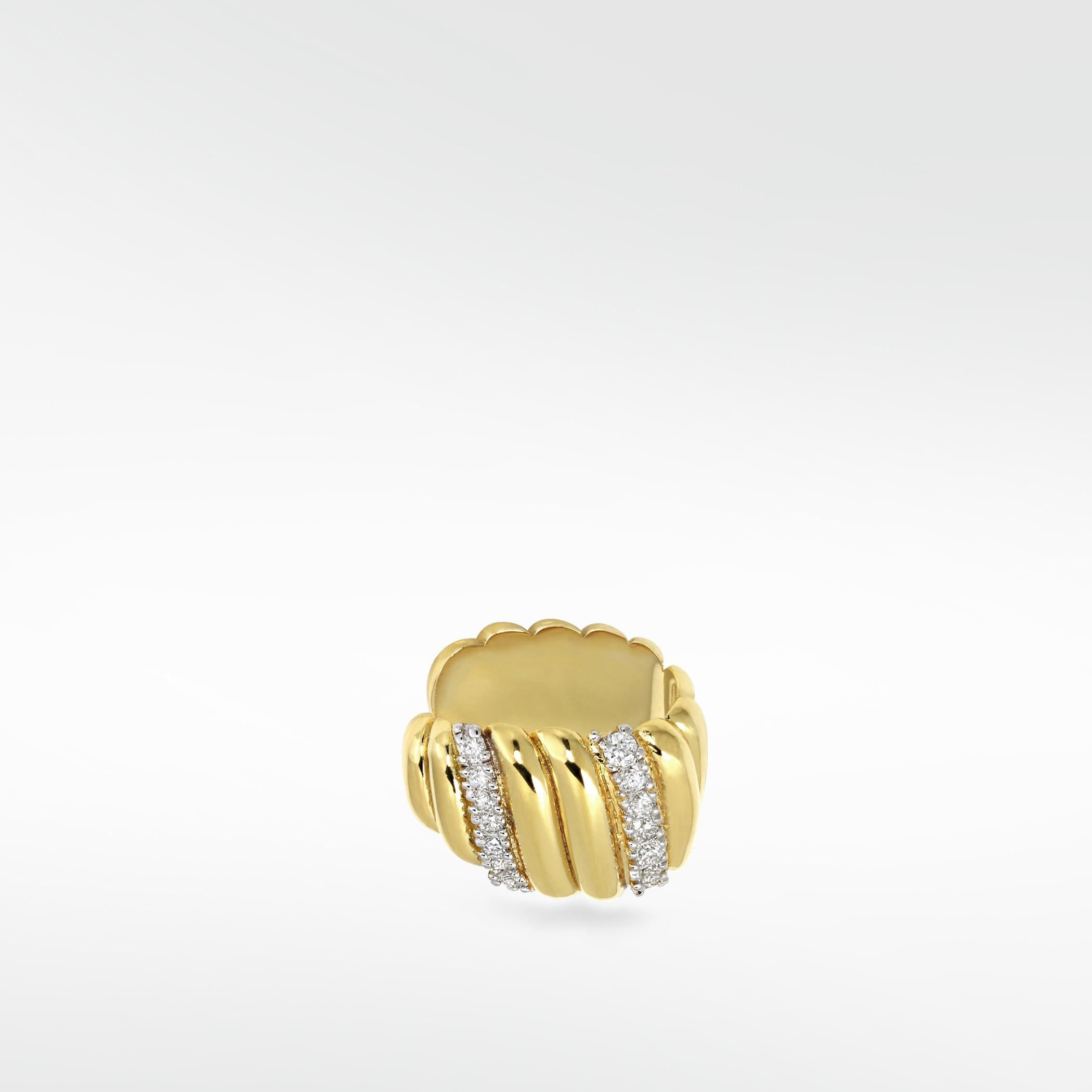 The Palm Diamond Ear Cuff in ridged yellow gold, featuring two sparkling bands of pavé diamonds on a white background.