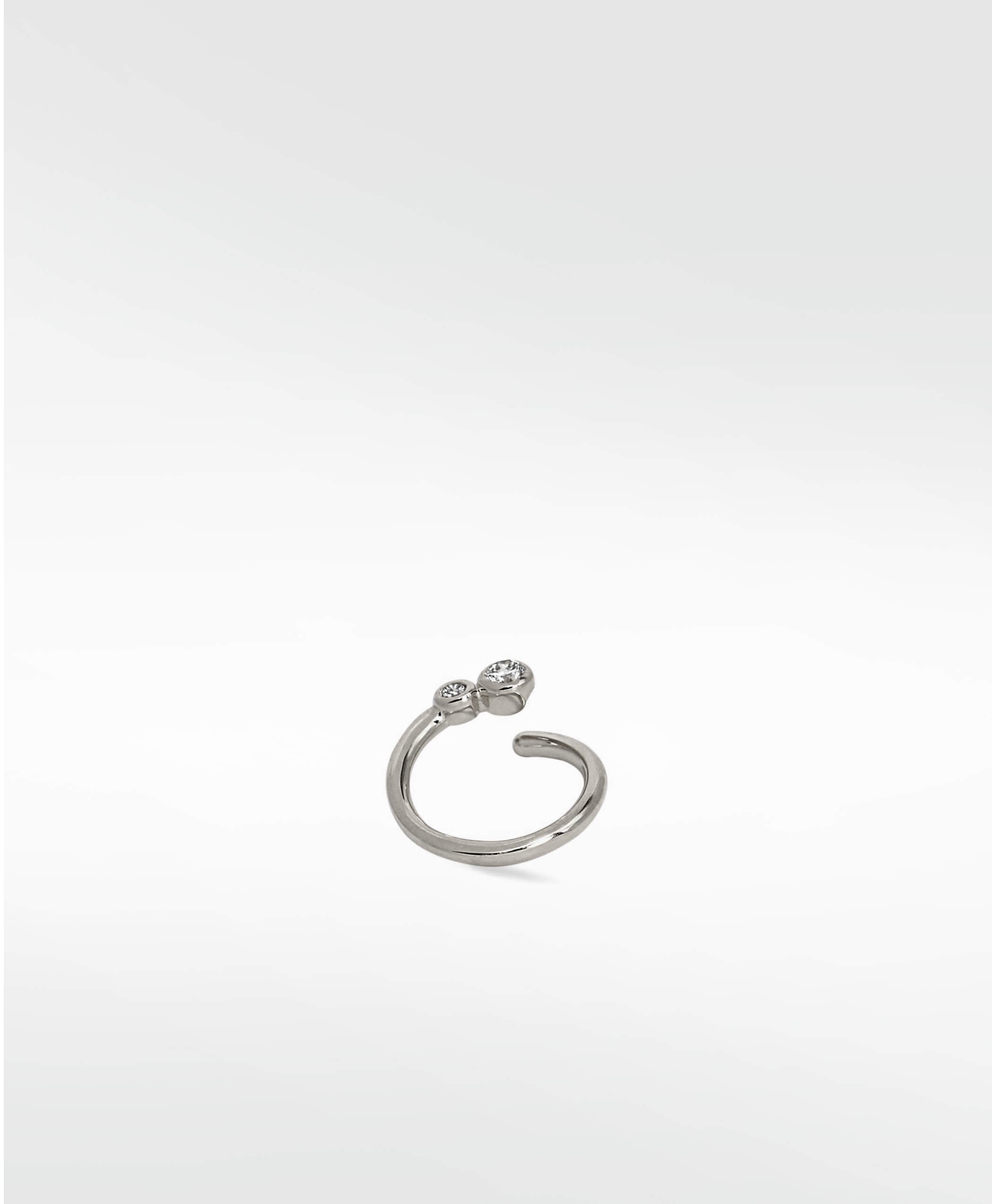 The Interstellar Nocturnal Curative Hoop earring in white gold, with two brilliant created diamonds on an open cuff design.