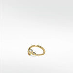 The Interstellar Nocturnal Curative Hoop earring in yellow gold, featuring two bezel-set, lab-grown diamonds.