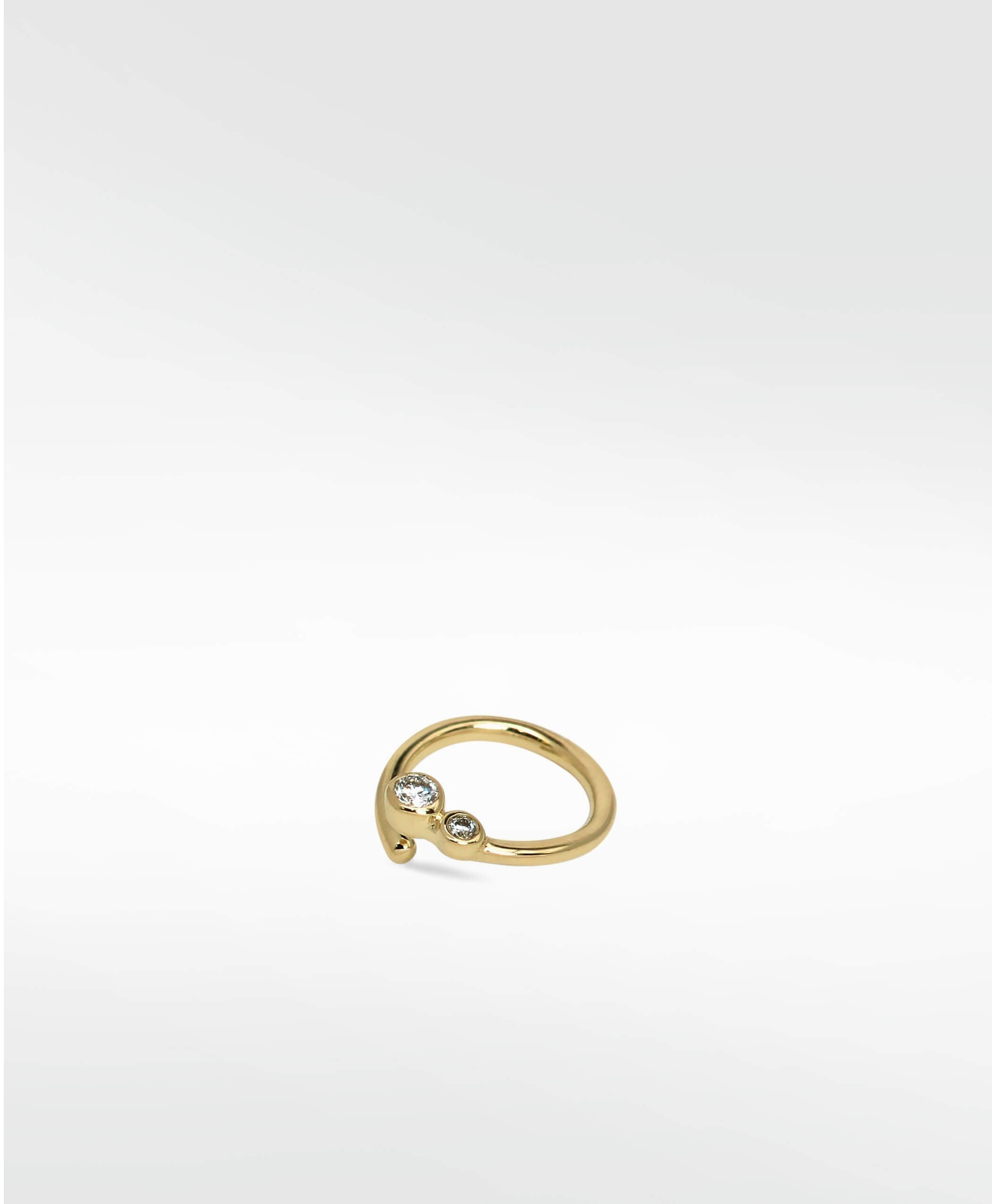 The Interstellar Nocturnal Curative Hoop earring in yellow gold, featuring two bezel-set, lab-grown diamonds.
