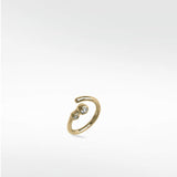 Interstellar Nocturnal Curative Hoop in 14K yellow gold with two bezel-set lab diamonds on a white background.