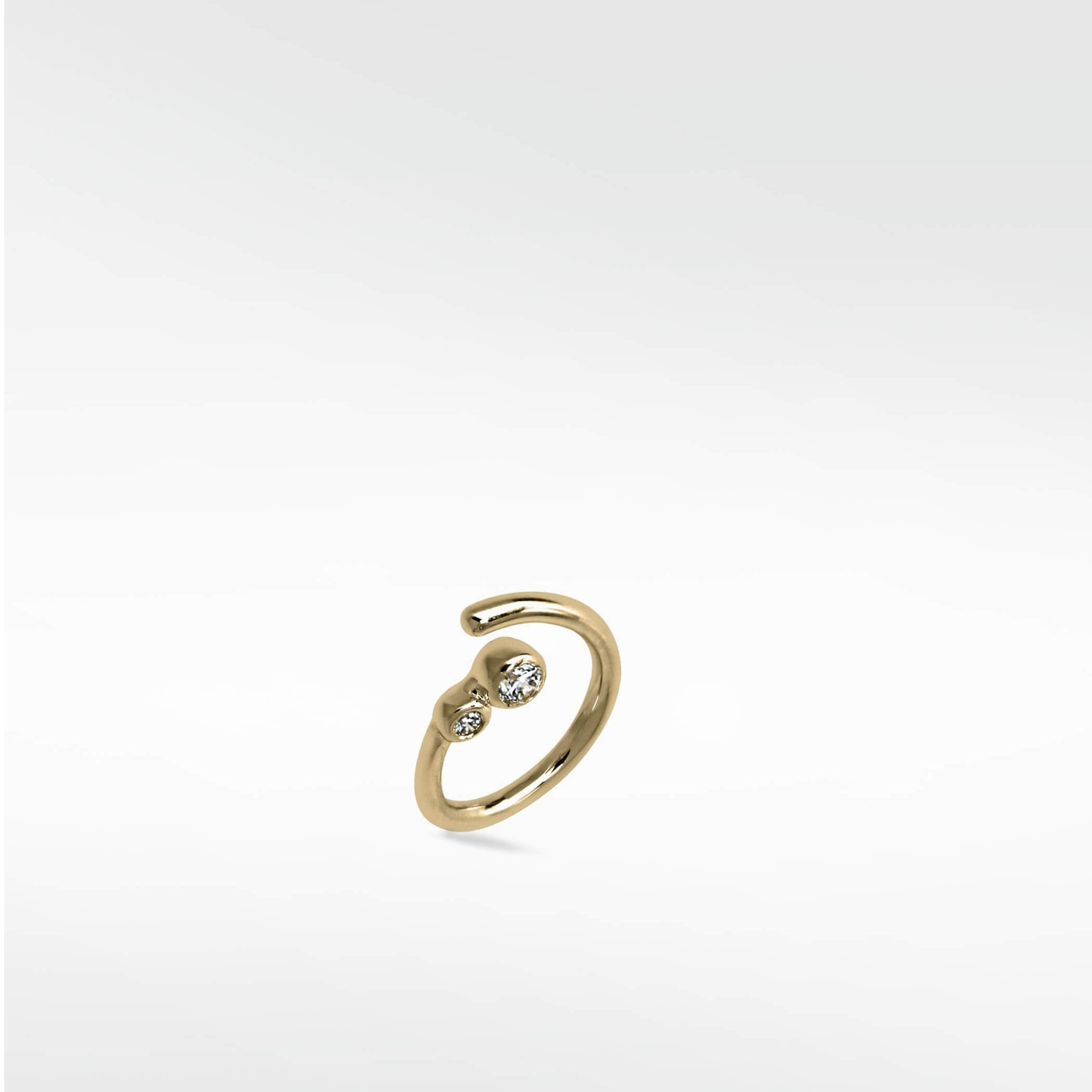Interstellar Nocturnal Curative Hoop in 14K yellow gold with two bezel-set lab diamonds on a white background.