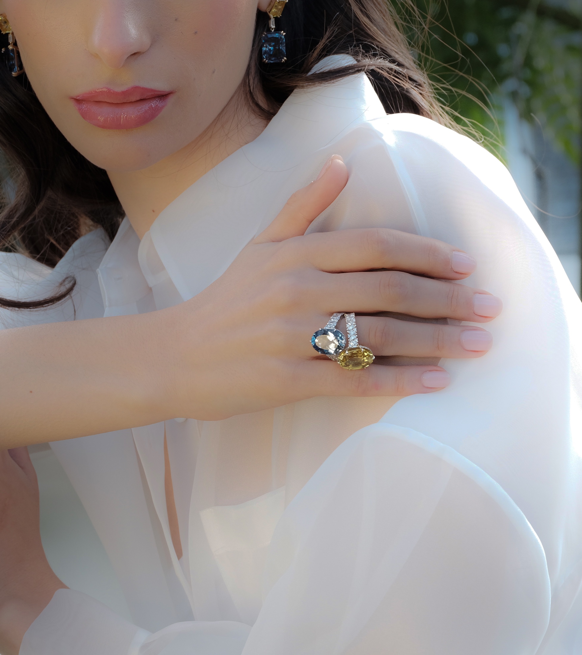 Model wearing Fitzrovia coloured-stone rings and earrings